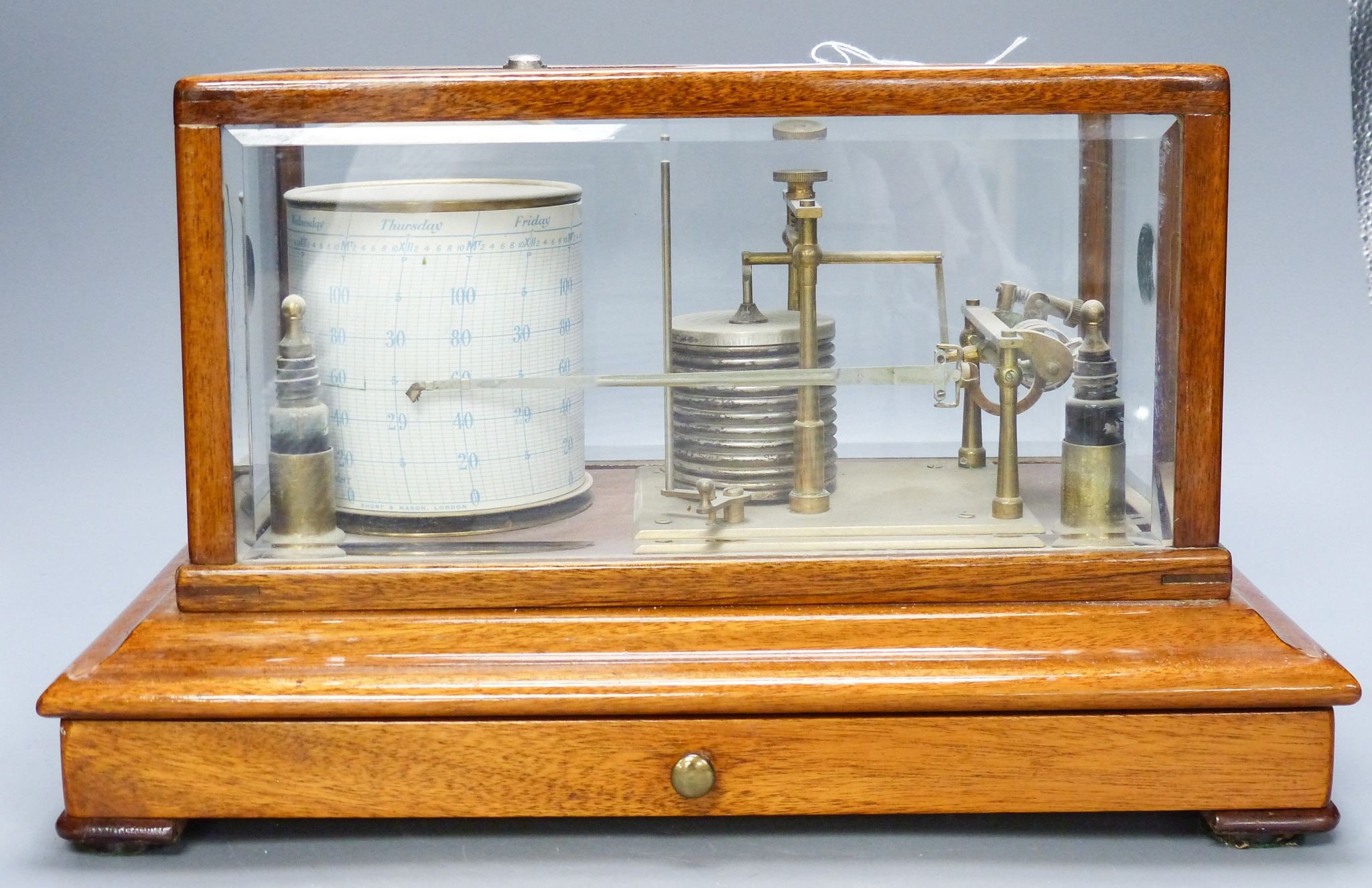 A mahogany cased barograph by Negretti & Zambra No C.13658 with spare graph paper in drawer 37cm